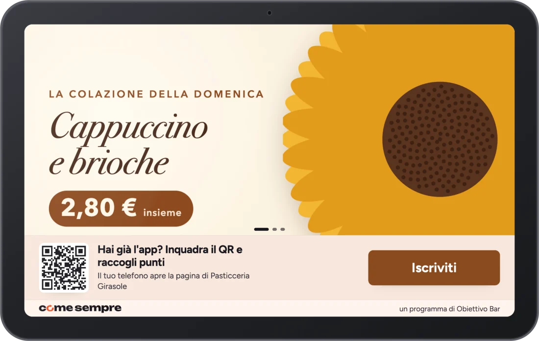Il tablet di come sempre con la vetrina di una pasticceria: la promo della colazione, il QR da inquadrare per raccogliere i punti e il tasto Iscriviti